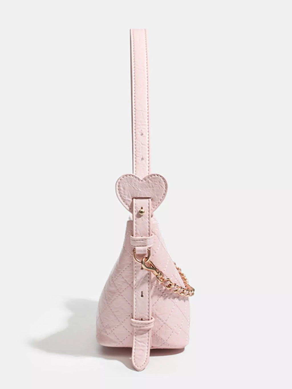 Pink quilted handbag with heart-shaped strap and gold chain detail, trendy fashion accessory