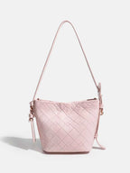 Pink quilted bucket bag with adjustable strap, stylish fashion accessory for women
