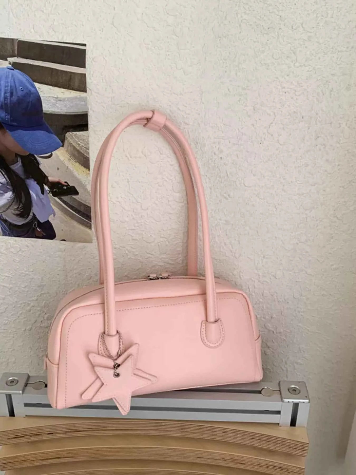 Pink bowler bag with star charm, trendy fashion accessory for women