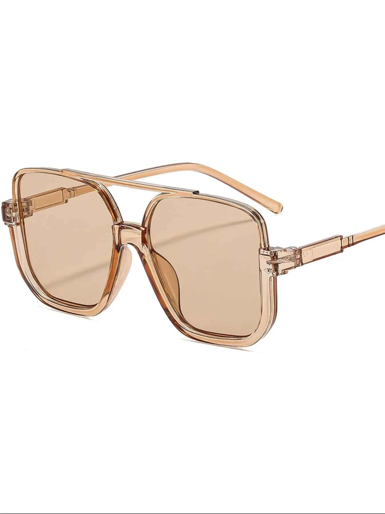 Trendy oversized square sunglasses with translucent brown frames and tinted lenses, perfect for fashion-forward looks.