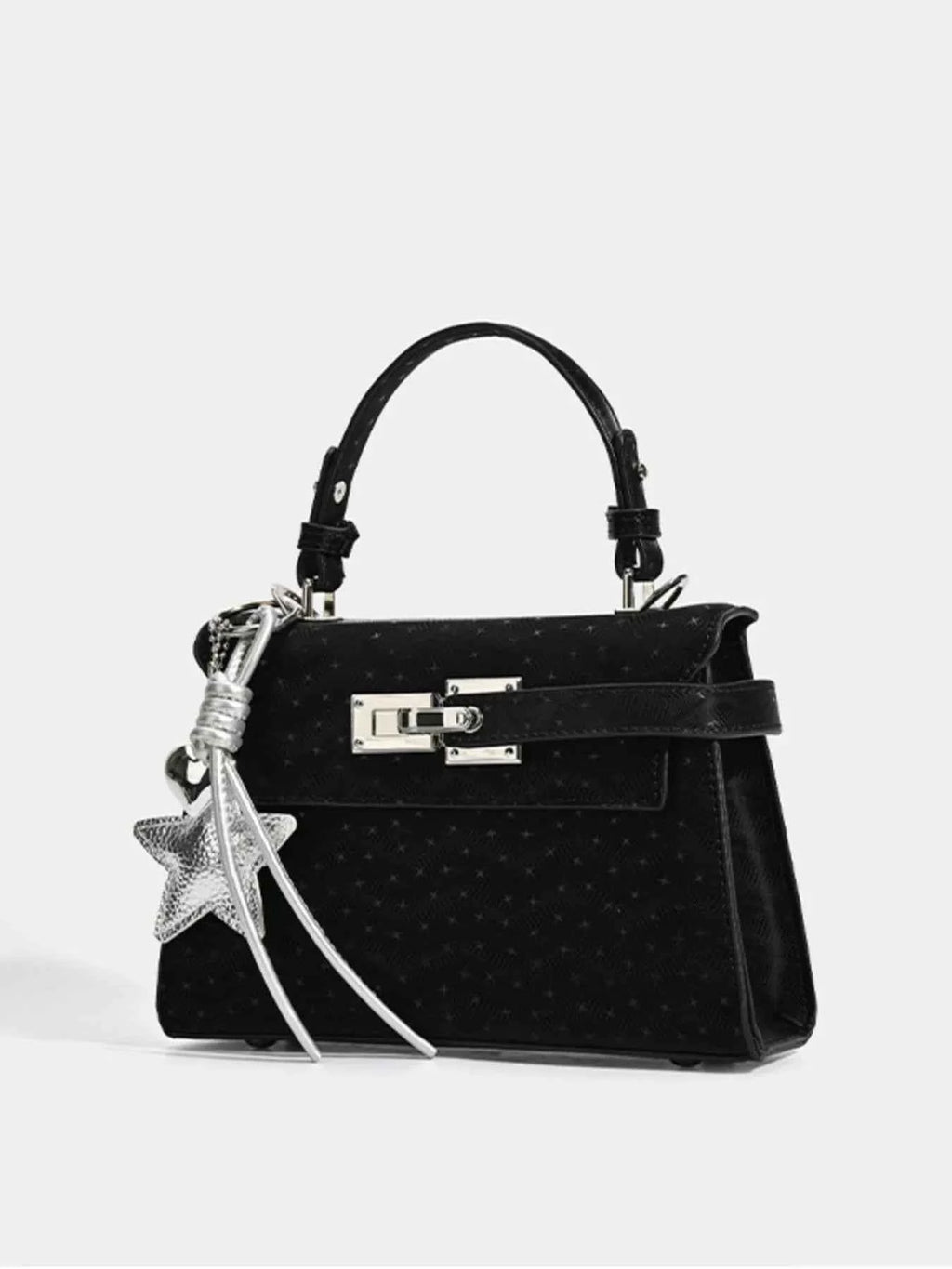 Black textured handbag with silver star charm and top handle, stylish fashion accessory