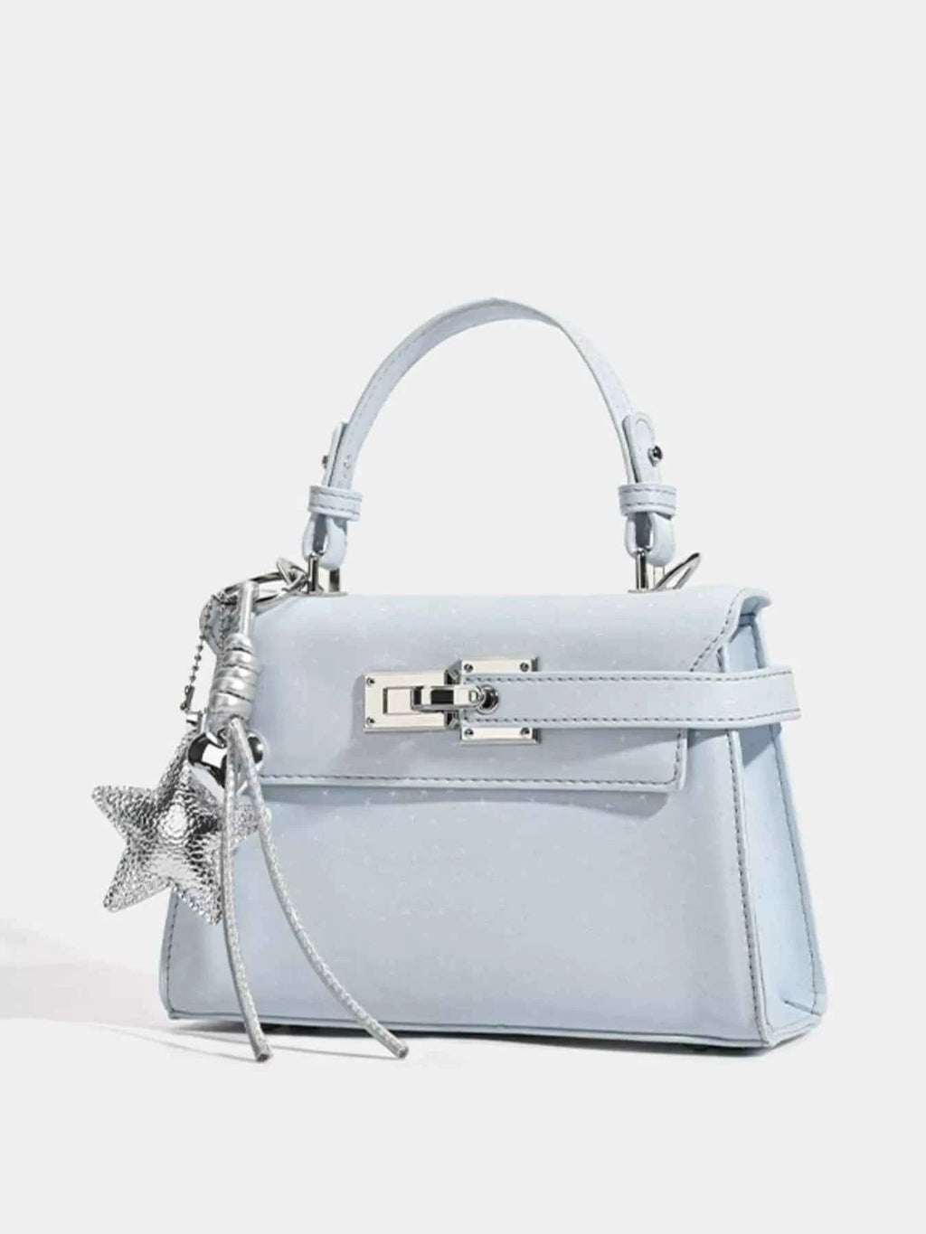 Light blue glitter handbag with star charm and silver hardware, trendy fashion accessory